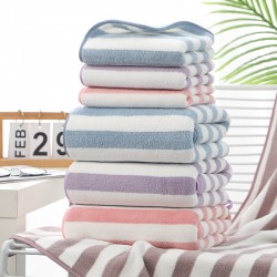 Manufacturer's wholesale warp-knitted high-density coral fleece towels, thickened face towels with logos, for foreign trade.